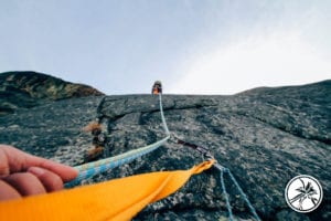 hiker being pulled up a mountain