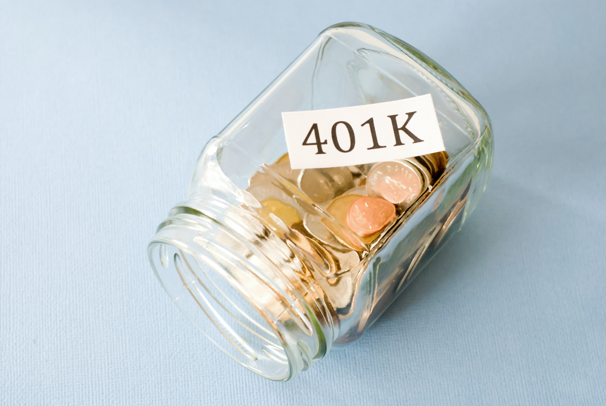 coins in a jar with 401k label on it