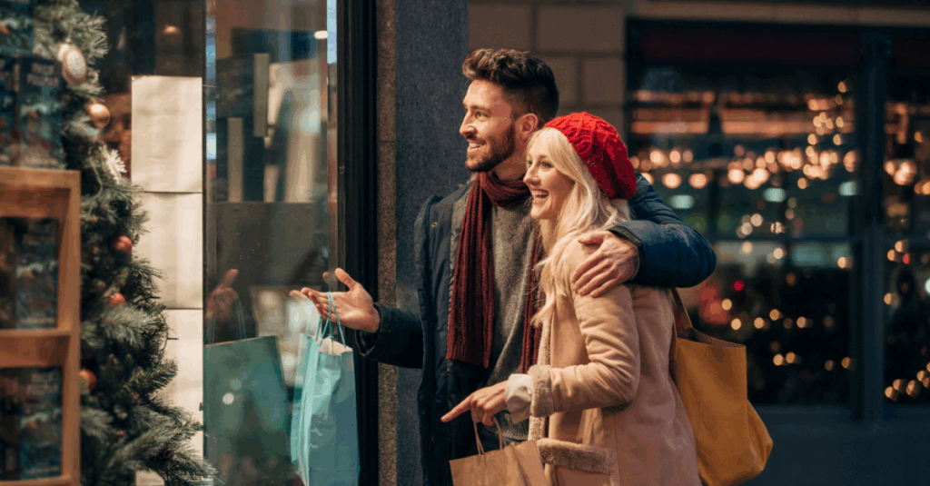 couple looking cozy shopping for christmas gifts