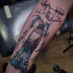 scary wendigo tattoo with black and blue