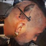 indigenous themed head tattoo