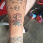mario-themed tattoo with mario boo and other characters