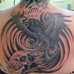 back tattoo of an eagle and a skull