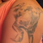 black and white pitbull tattoo on shoulder
