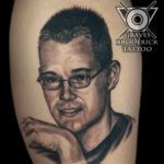 tattoo portrait man with glasses