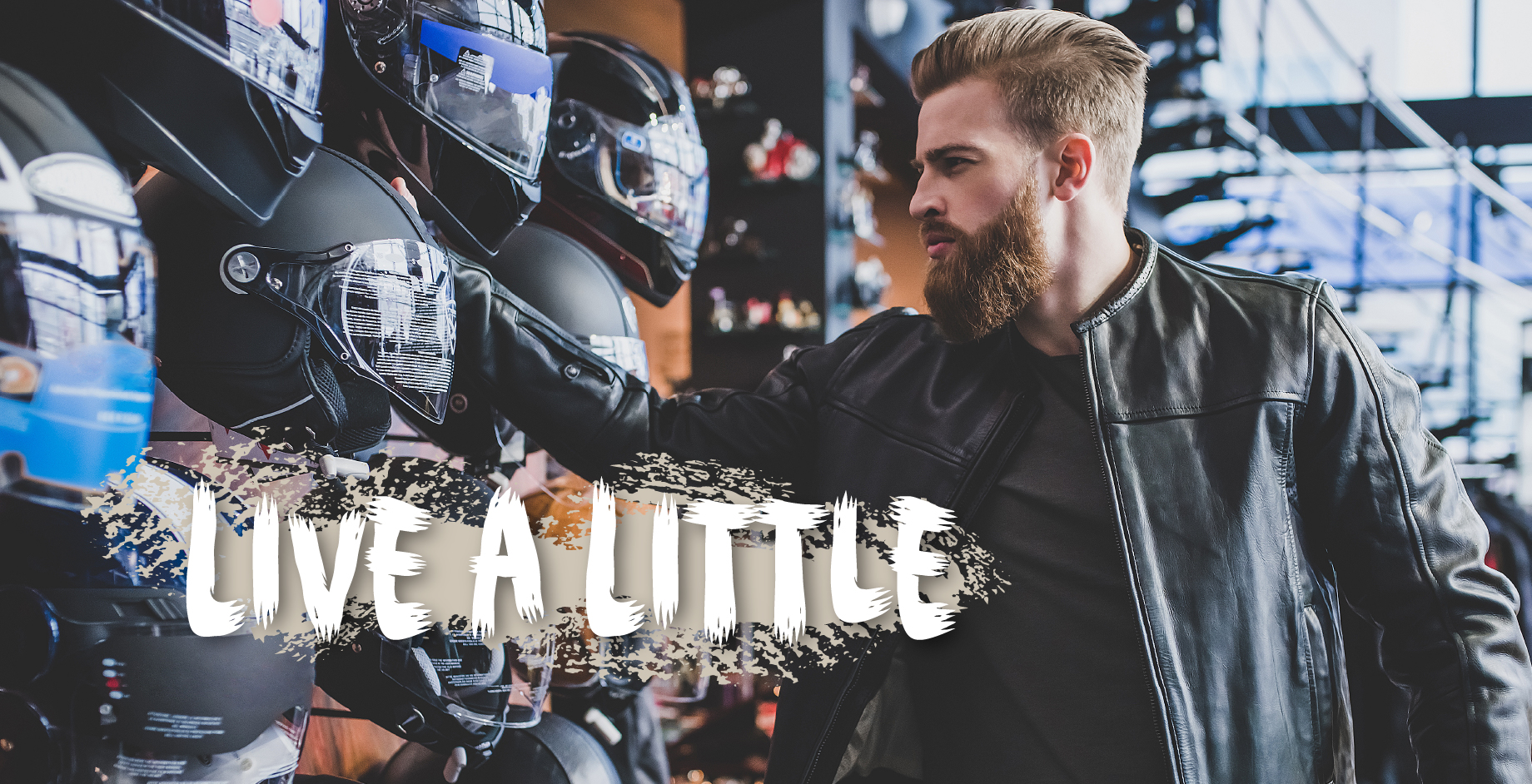 styled man looking at helmets with live a little